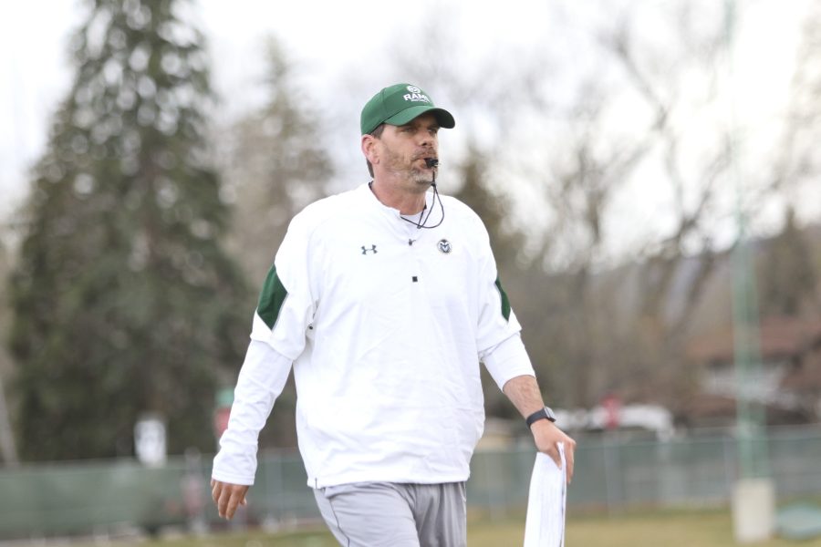 Head Coach Mike Bobo walking towards the team huddle during the CSU football spring practice. (Javon Harris | Collegian)