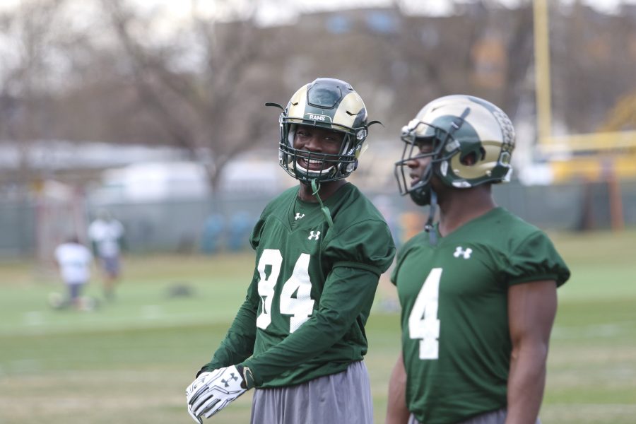 Preston Williams (84) and Michael Gallup (4) laugh with one another during the wide receiver drills at the spring practice. (Javon Harris | Collegian)