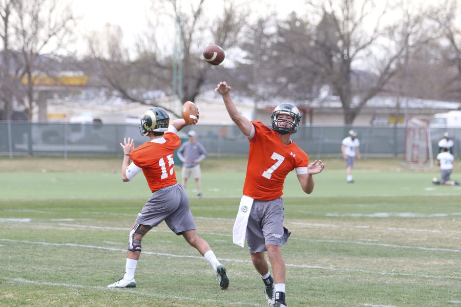 Nick Stevens (7) and Colin Hill (15) both throw passes during a couple Quarterback drills during their spring practice. (Javon Harris | Collegian)