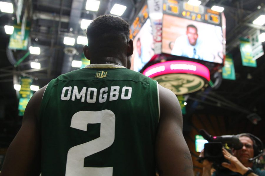 CSU Senior Emmanuel Omogbo stands and watches his video on the jumbotron before being honored at Senior Night on February 28. (Elliott Jerge | Collegian)