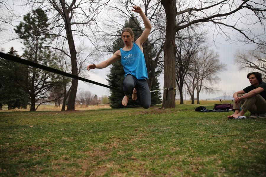 Colorado State University student Luke Stark, seeking an Environmental Engineering degree, practices his slacklining skills on Tuesday afternoon near Laurel Street . (Forrest Czarnecki | Collegian)