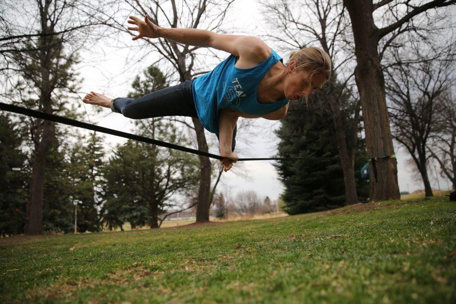 Colorado State University student Luke Stark, seeking an Environmental Engineering degree, practices his slacklining skills on Tuesday afternoon near Laurel Street . (Forrest Czarnecki | Collegian)