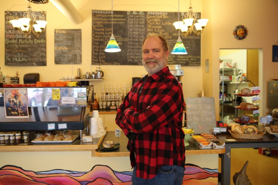 Colin Gerety, the owner of Momo Lolo Coffee House, poses for a portrait at the coffee house on Tuesday afternoon. Some of the businesses along Elizabeth Street have been affected by the construction happening at the intersection of Shields and and Elizabeth Streets. (Forrest Czarnecki | Collegian)