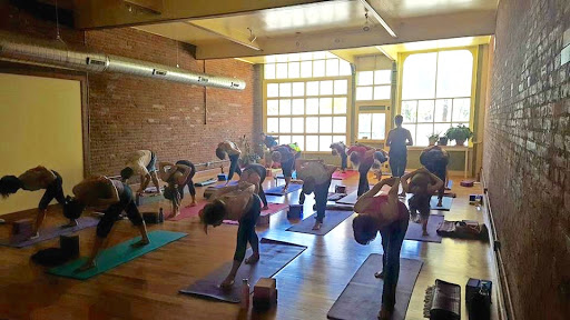 Cat Lauer teaches a yoga class at Old Town Yoga. Photography is discouraged in Yoga for Recovery classes to protect the identities of those in attendance. (Photo courtesy of Cat Lauer)