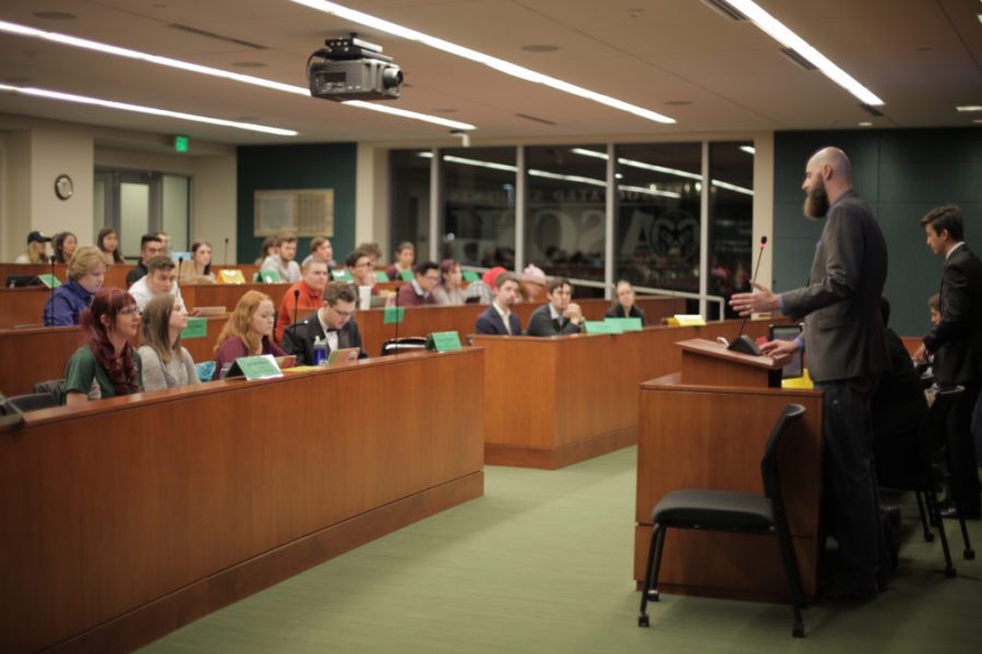 Members of the ASCSU Senate listen to guest presenter, Duane Hansen, during Wednesday night's meeting. Hansen spoke to the body about his campaign for the 5th district of Fort Collins City Council, which includes CSU. Hansen is a former ASCSU senate member. (Natalie Dyer | Collegian)
