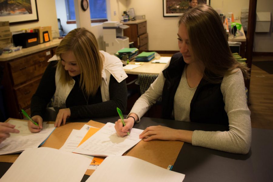 On Feb. 27, sophomores Jessica Neal and Haley Hanna renew their apartment lease for another year. (Jenna Van Lone I Collegian)
