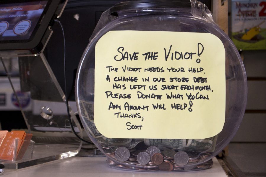 The last video rental store in Fort Collins, the Village Vidiot run by Scott Shepperd, keeps a donation bucket at the front of its store in light of recent construction limiting the amount of people visiting the area. (Brooke Buchan | Collegian)