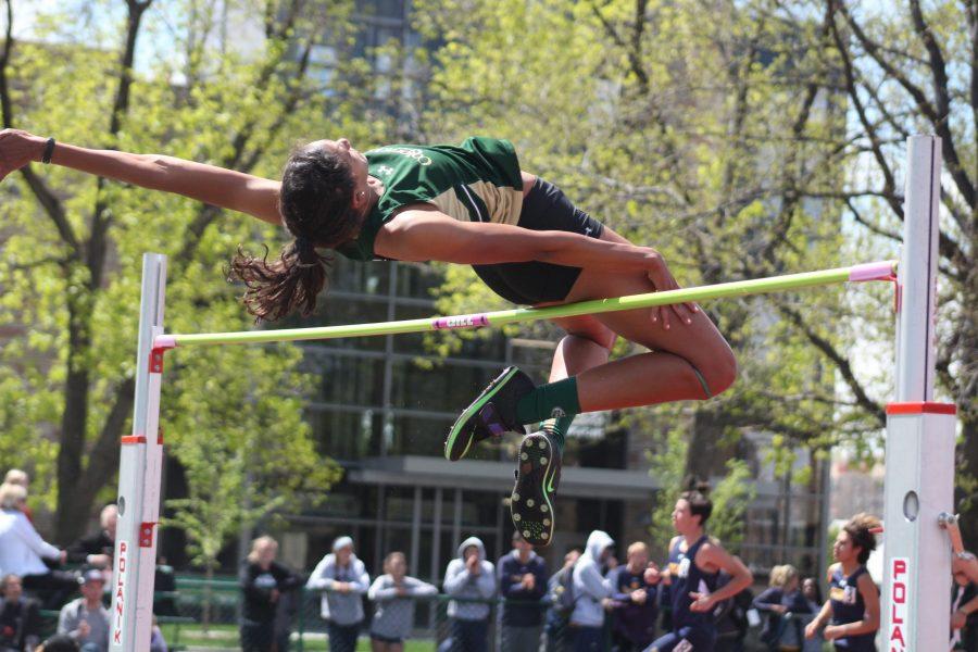 Junior high jump athlete McKenzie Wright clears the bar at the Jack Christiansen track meet on Saturday April 22, 2017. McKenzie won the high jump with a hight of 5 feet and 5.75 inches. (Matt Begeman | Collegian)
