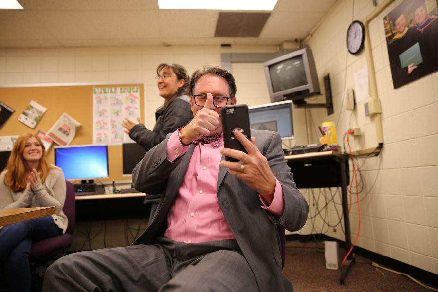 Kevin Hall celebrates and shares a phone call with some colleagues of his after hearing the announcement that an investigative reporting team he was on won the 2017 Pulitzer Prize for Explanatory Reporting on the "Panama Papers". (Forrest Czarnecki | Collegian)