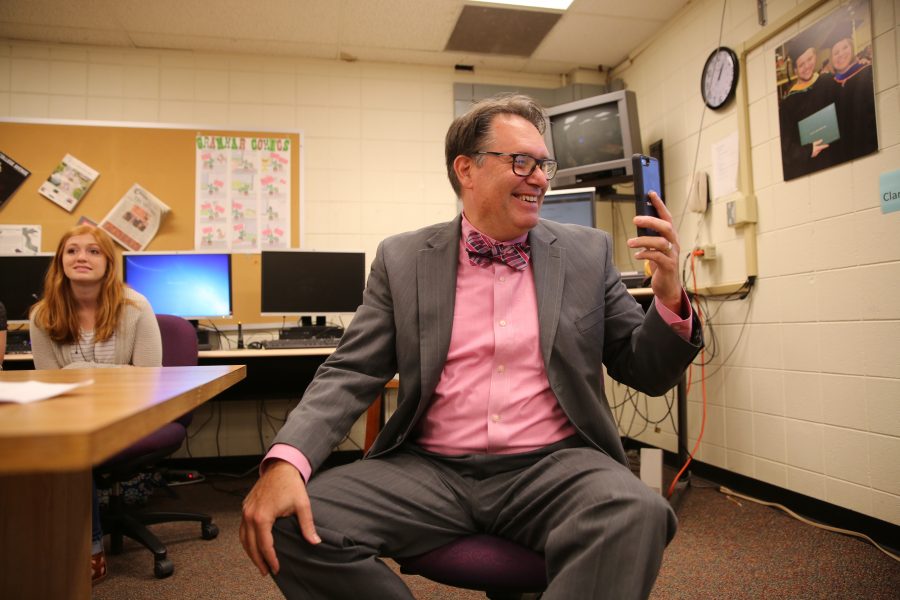 Kevin Hall celebrates and shares a phone call with some colleagues of his after hearing the announcement that an investigative reporting team he was on won the 2017 Pulitzer Prize for Explanatory Reporting on the "Panama Papers". (Forrest Czarnecki | Collegian)