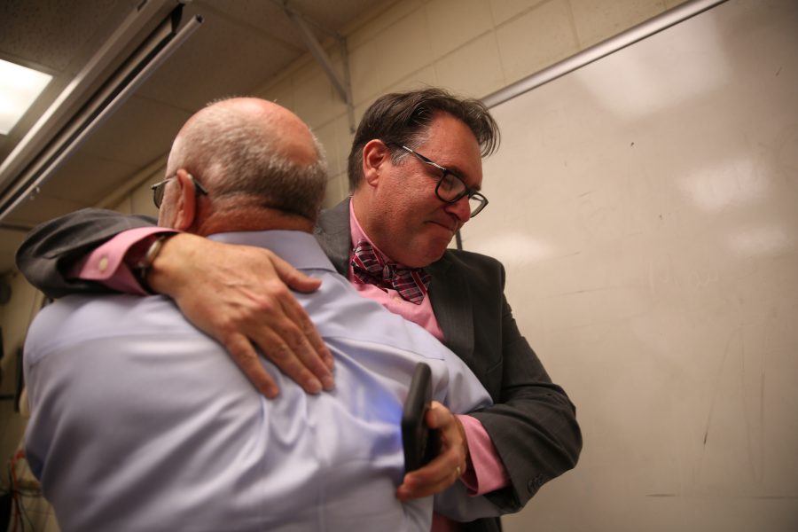 Kevin Hall, facing, shares an embrace with colleague Rob Reuteman after hearing the announcement that an investigative reporting team Hall was on won the 2017 Pulitzer Prize for Explanatory Reporting on the "Panama Papers". (Forrest Czarnecki | Collegian)