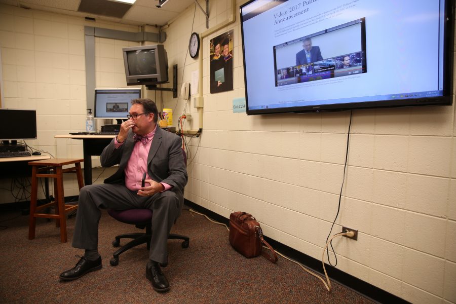 Kevin Hall tries to hold back tears after hearing the announcement that an investigative reporting team he was on won the 2017 Pulitzer Prize for Explanatory Reporting on the "Panama Papers". (Forrest Czarnecki | Collegian)