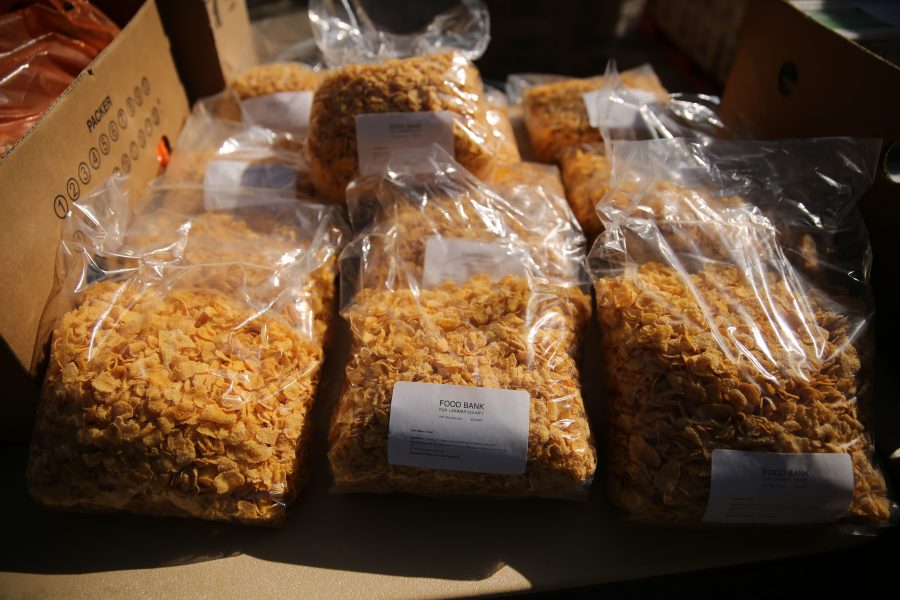 Assorted types of food line the tables at an event put on by SLiCE and the Larimer County Food Bank on Thursday afternoon in front of the Sherwood Forest. The event was put on to help fight food insecurity at Colorado State University. (Forrest Czarnecki | Collegian)