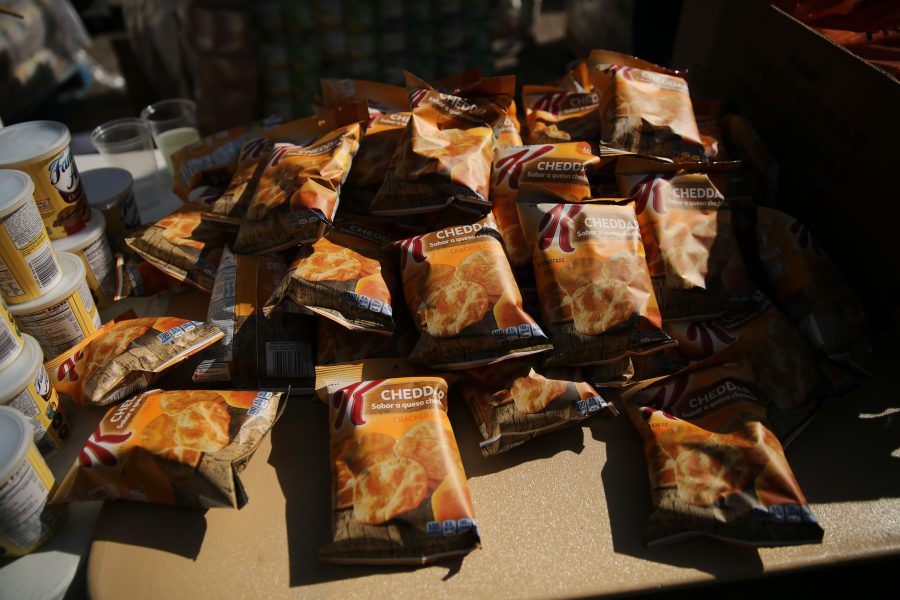 Assorted types of food line the tables at an event put on by SLiCE and the Larimer County Food Bank on Thursday afternoon in front of the Sherwood Forest. The event was put on to help fight food insecurity at Colorado State University. (Forrest Czarnecki | Collegian)