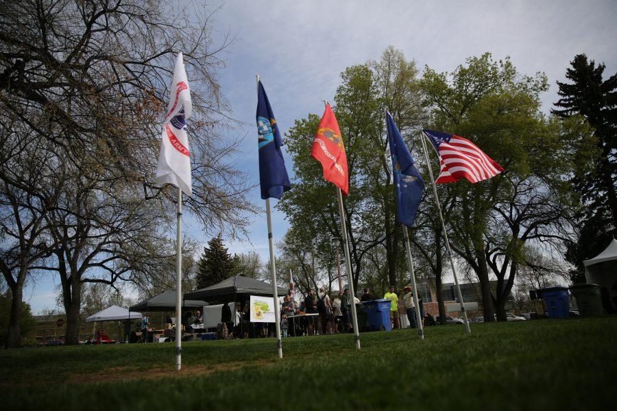 Flags near the event tents wave in a breeze before the start of Operation Bear Hug on Sunday morning at Colorado State University.  (Forrest Czarnecki | Collegian)