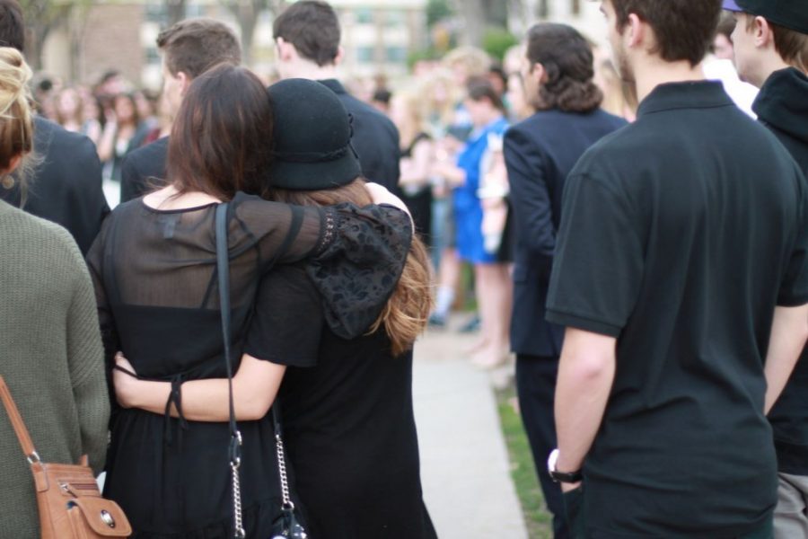Community members embrace each other in the center of the Oval (Collegian file photo).