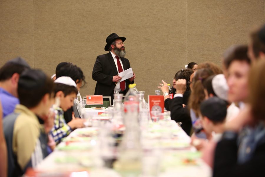 Rabbi Yerachmiel Gorelik speaks to those in attendance of CSUs Passover Seder event hosted by the Chabad Jewish Student Organization. All photos were taken before sunset in accordance with Jewish tradition. (Davis Bonner | Collegian) 