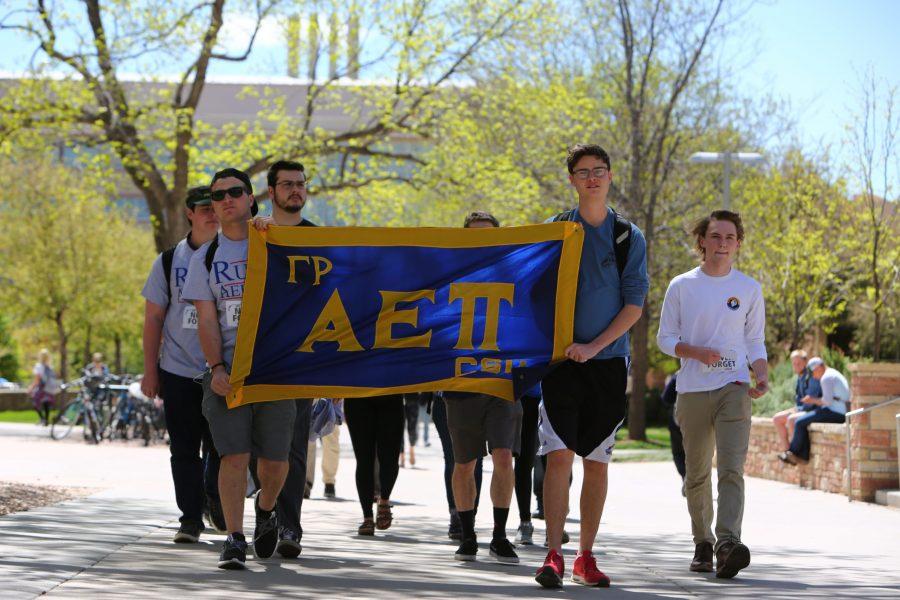 Members of the Alpha Epsilon Pi fraternity make their way to the oval during the first annual Walk to Remember the Holocaust around campus. (Davis Bonner | Collegian)
