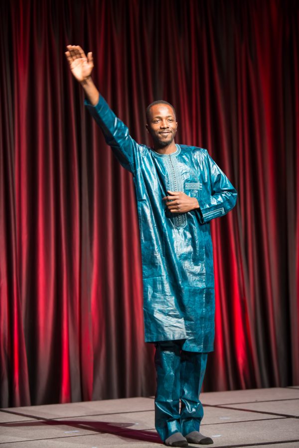 A representative from Senegal displays their cultural dress during the Council of International Student Affairs organized fashion show. (Davis Bonner | Collegian)