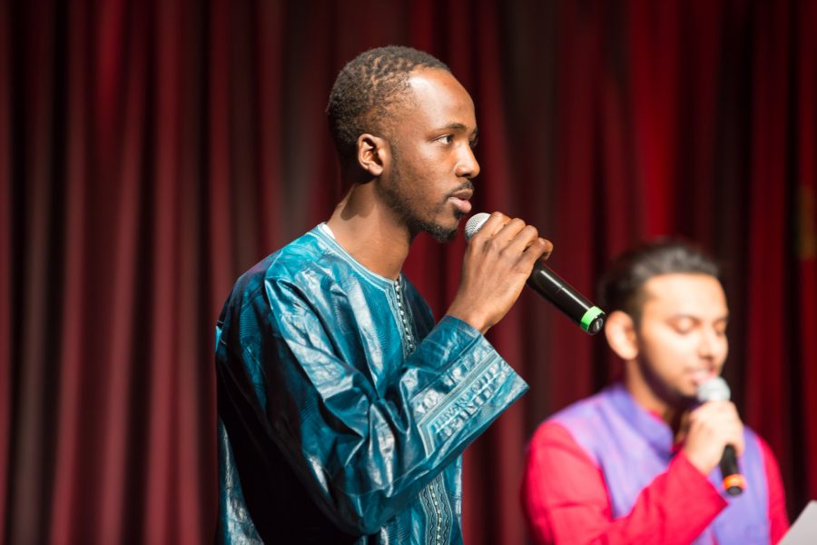 A representative from Senegal and India recite a poem together during the Council of International Student Affairs organized fashion show. (Davis Bonner | Collegian)