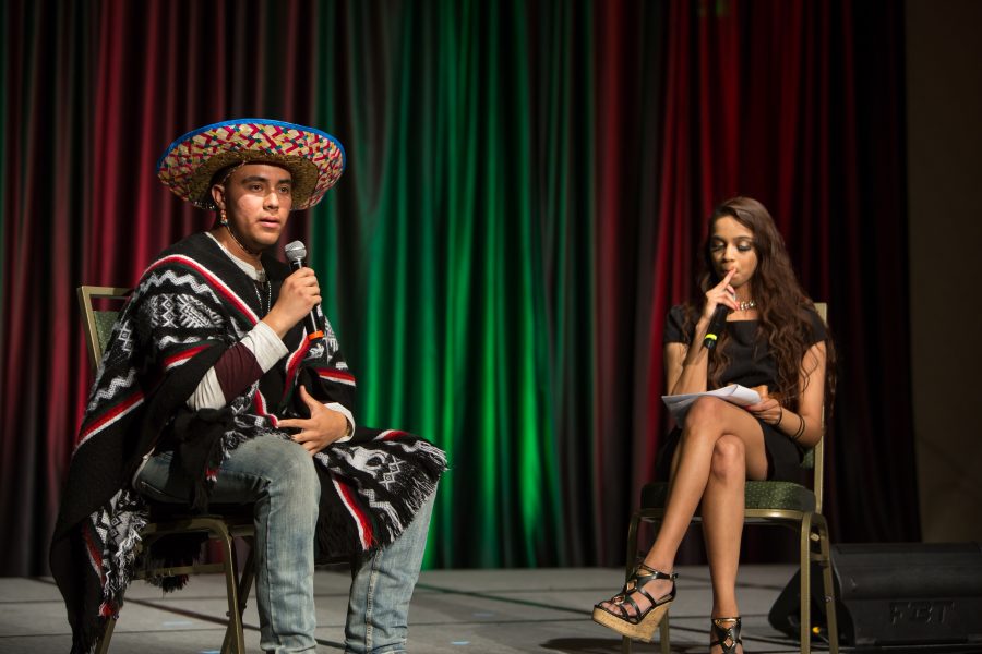 A representative from Mexico is interviewed during the Council of International Student Affairs organized fashion show. (Davis Bonner | Collegian)