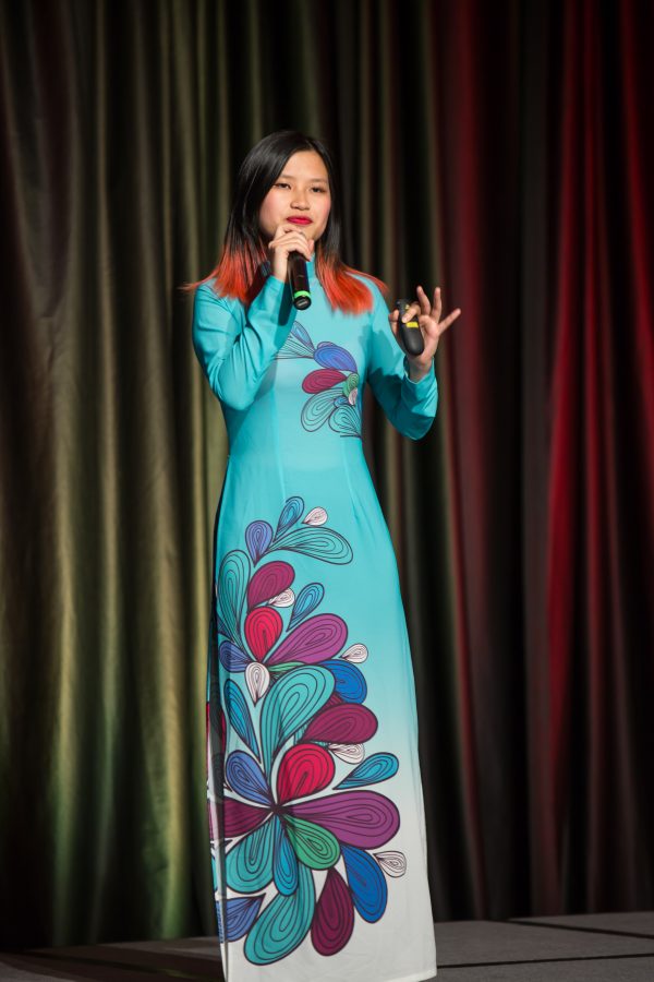 A representative from Vietnam displays their cultural dress during the Council of International Student Affairs organized fashion show. (Davis Bonner | Collegian)