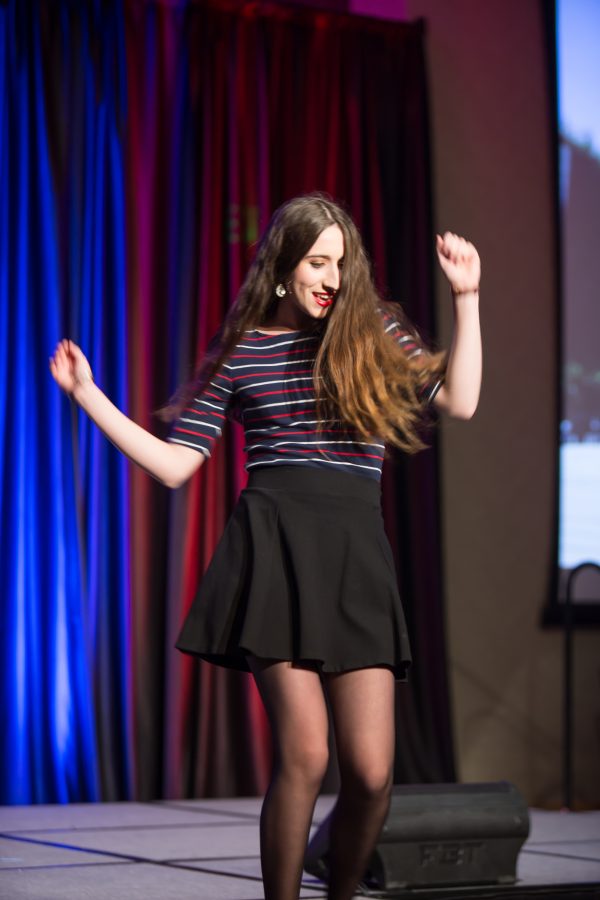 A representative from France displays their cultural dress during the Council of International Student Affairs organized fashion show. (Davis Bonner | Collegian)