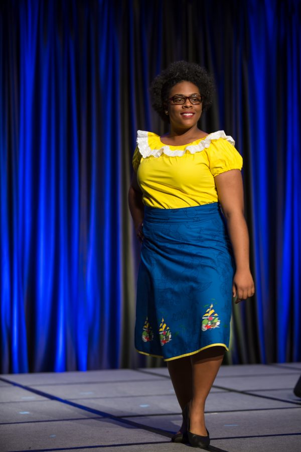 A representative from the The British Virgin Islands displays her cultural dress during the Council of International Student Affairs organized fashion show. (Davis Bonner | Collegian)