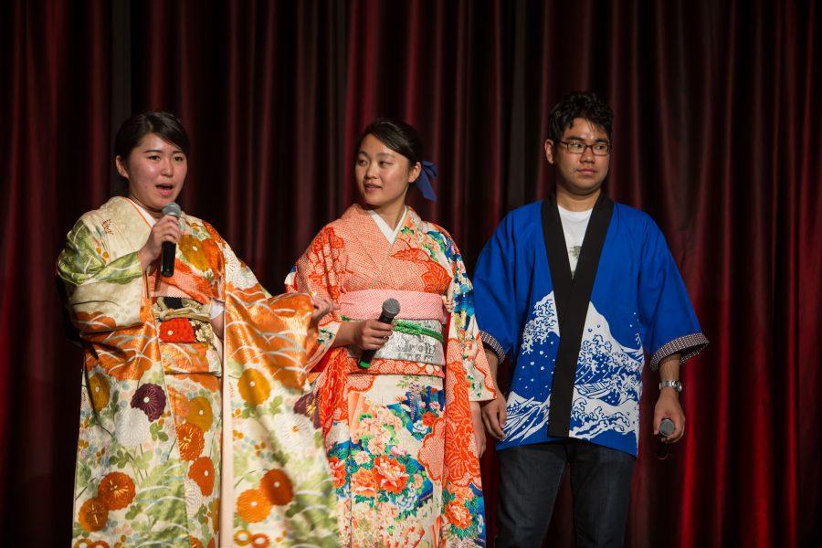 Representatives from Japan are interviewed during the Council of International Student Affairs organized fashion show. (Davis Bonner | Collegian)