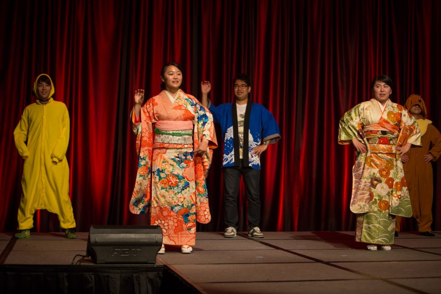 Representatives from Japan perform a cultural dance during the Council of International Student Affairs organized fashion show. (Davis Bonner | Collegian)