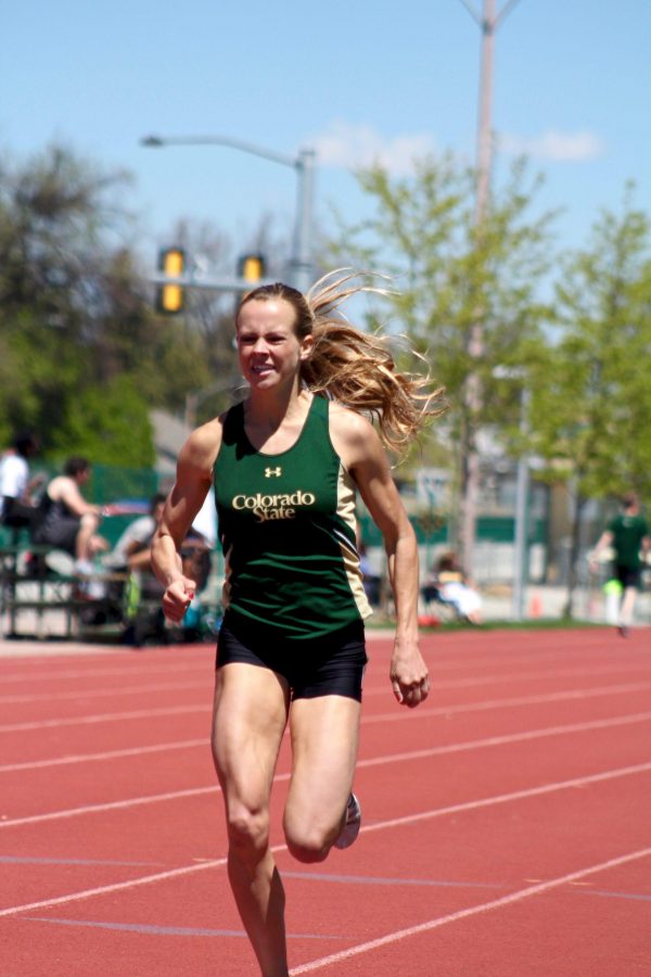 Junior middle distance athlete Macy Kreutz breaks the 18 -year-old 1,500 meter facility record recording a time of crosses the line to win the 1,500 meter race at the Rams vs. Cowboys Track meet on Friday May 5, 2017. (Matt Begeman | Collegian)