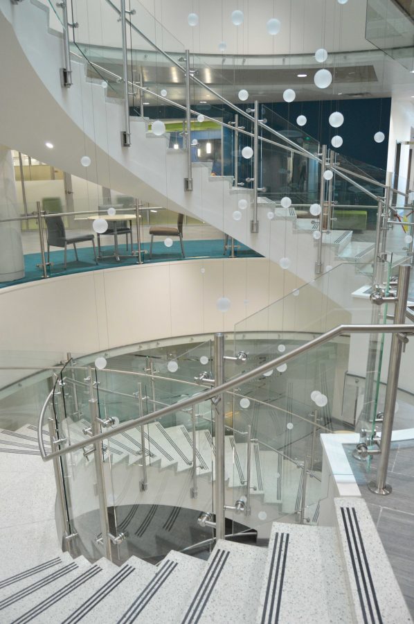 The New CSU Health and Medical center features a spiral staircase with a hanging art installation to encourage people to take the stairs, explained Kate Hagdorn, associate director of communications. Photo by Olive Ancell | Collegian
