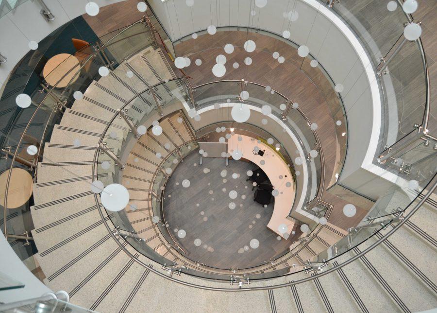 The New CSU Health and Medical center features a spiral staircase with a hanging art installation to encourage people to take the stairs, explained Kate Hagdorn, associate director of communications. Photo by Olive Ancell | Collegian
