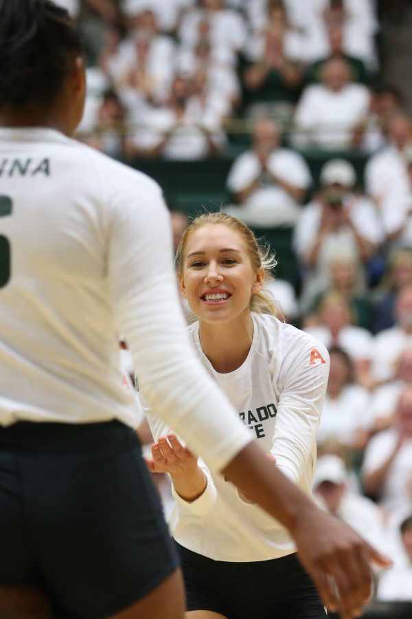 Colorado State Senior Mckenna Thornlow goes in for high five with teammate Jasmine Hanna during the season opener against Duke. (Elliott Jerge | Collegian)