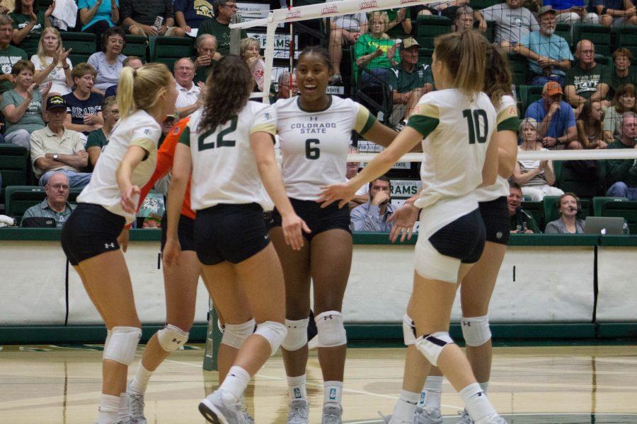 Jasmine Hanna smiles as the Rams celebrate her kill against UNC. (Ashley Potts | Collegian)