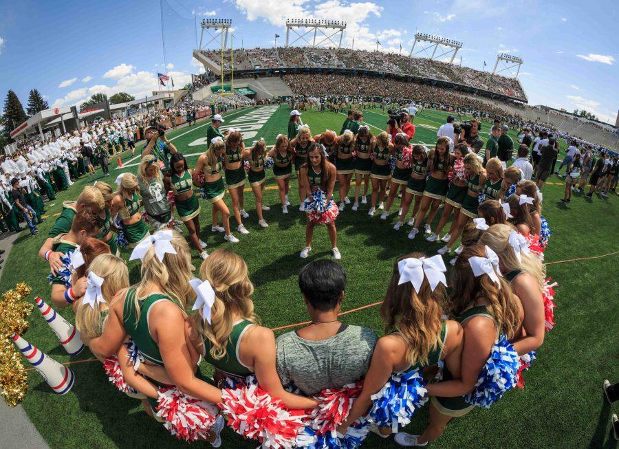 CSU's cheerleaders say a prayer before kickoff against Oregon State. (Davis Bonner | Collegian)
