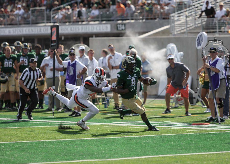 CSU wide receiver Detrich Clark shakes off Oregon State outside linebacker Shermar Smith during the first game of the season. (Davis Bonner | Collegian)