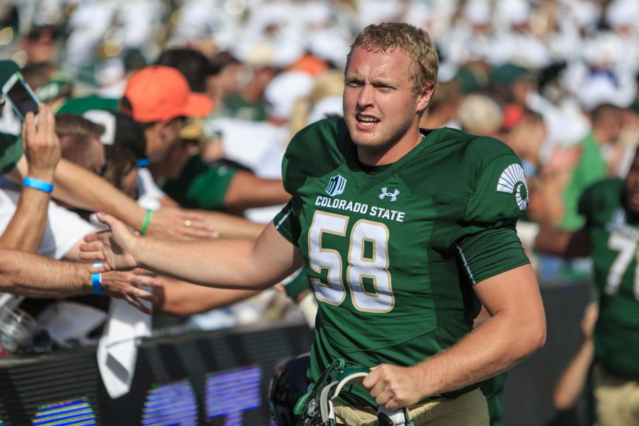 CSU linebacker Trent Sieg celebrates the team's victory with fans after crushing Oregon State 58-27. (Davis Bonner | Collegian