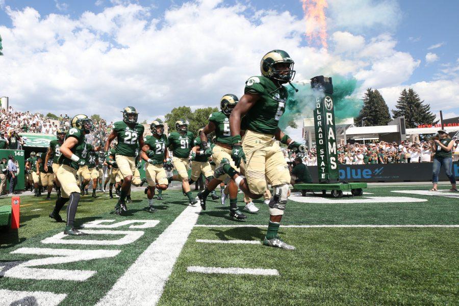The CSU Football Team runs out to the New On-campus Stadium on August 26, 2017. The Rams were welcomed to the field by a sold out crowd. (Elliott Jerge | Collegian)
