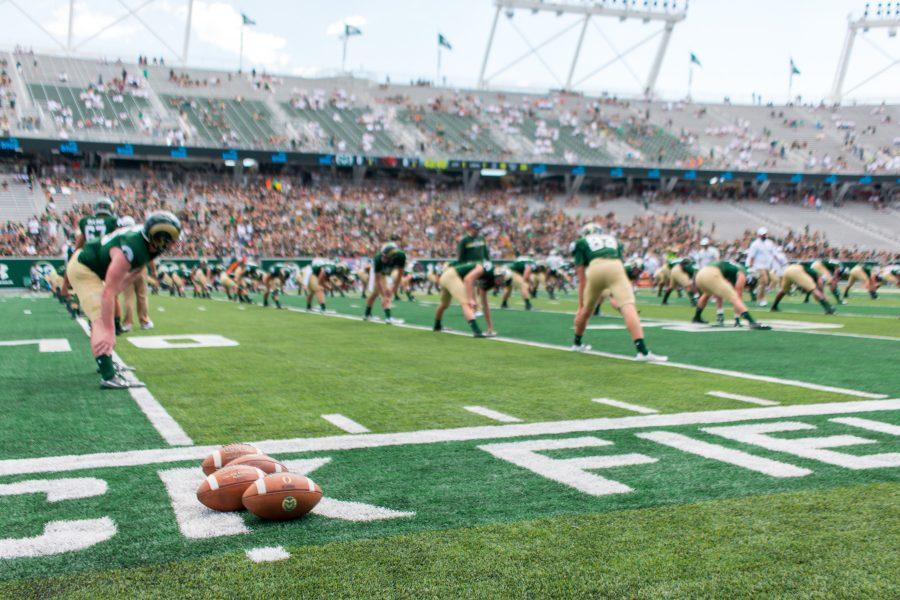 The Colorado State football team stretches before picking up the ball to kick off the 2017 season at the new on campus stadium. . (Jack Starkebaum | Collegian)