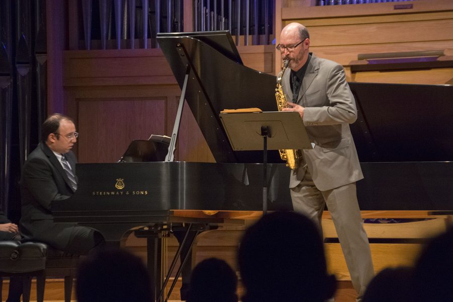 CSU faculty member Peter Sommer plays the saxophone while Chris Reed plays the piano at the University Center for the Arts on Monday. (Jenn Yingling | Collegian)
