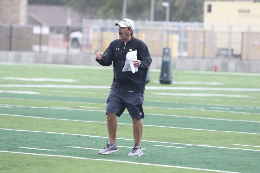 Head Coach Mike Bobo shows some intensity and emotion during one of the CSU Football drills on August 1st at the new CSU stadium practice field. (Javon Harris | Collegian)