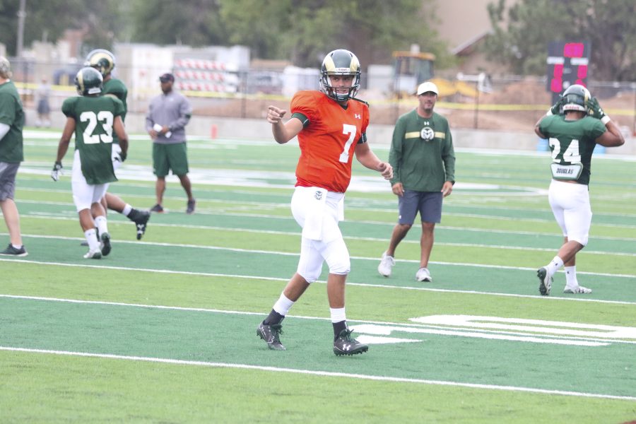 Senior Quarterback Nick Stevens (7) points at Michael Gallup after Gallup makes a consecutive catch from Stevens during one of the CSU Football drills on August 1st at the new CSU stadium practice field. (Javon Harris | Collegian)