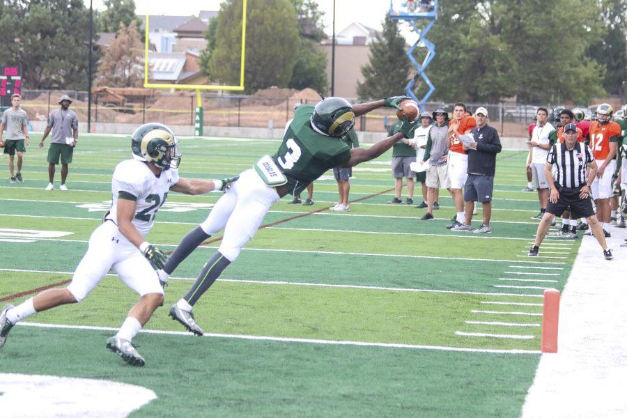 Freshman Wideout EJ Scott (3) makes a goal line grab during one of the CSU Football drills on August 1st at the new CSU stadium practice field. (Javon Harris | Collegian)