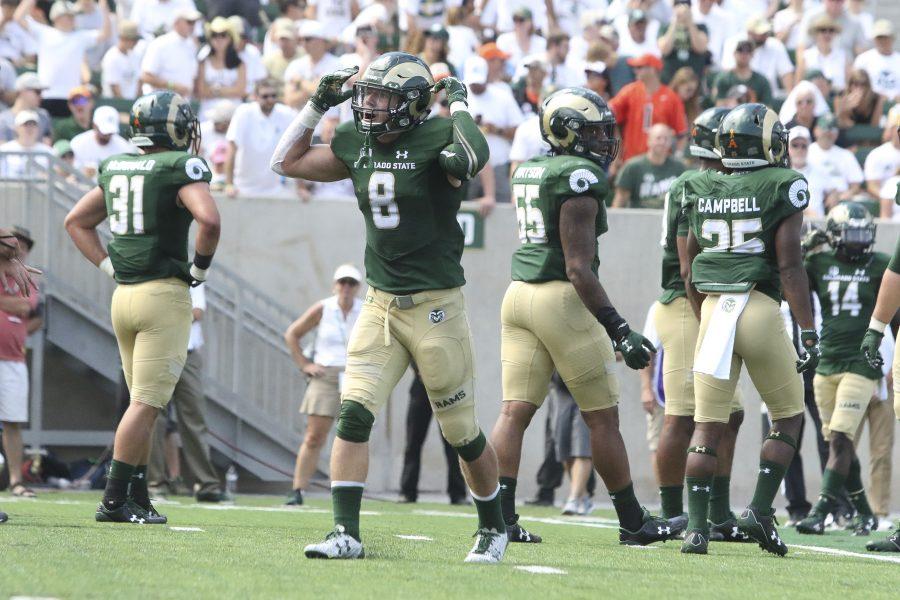 Senior safety Jake Schlager (8) pumps up the crowd before a third down stop during CSU's game against Oregon State. The Rams beat the Beavers 58-27. (Javon Harris | Collegian)