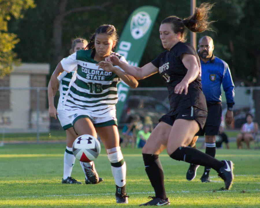 Freshman midfielder, Alyssa Yoshida, runs past a Buffs player during the home opening game on Friday, August 18. CSU and CU ended the game tied at zero. (Ashley Potts | Collegian)