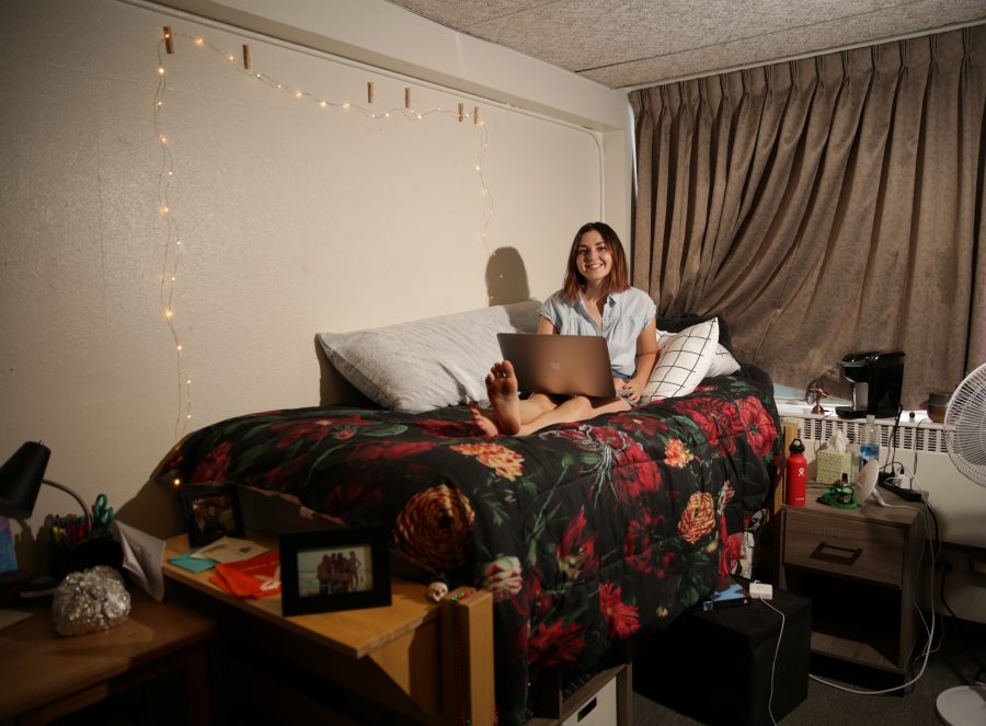 Madison Rogers, a freshman at Colorado State University, poses for a portrait on her bed in her dorm room at Newsom hall on Friday afternoon. Forrest Czarnecki | The Collegian