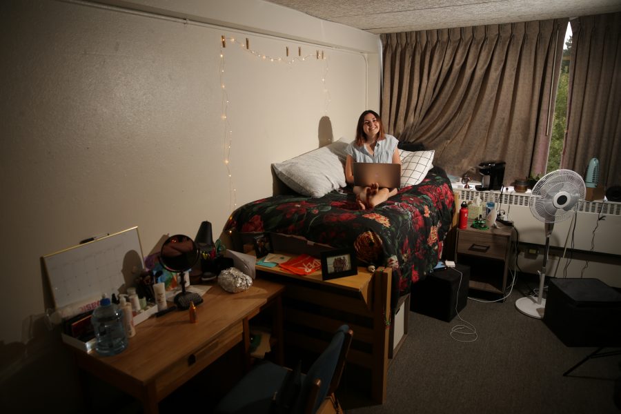 Madison Rogers, a freshman at Colorado State University, poses for a portrait on her bed in her dorm room at Newsom hall on Friday afternoon. Forrest Czarnecki | The Collegian