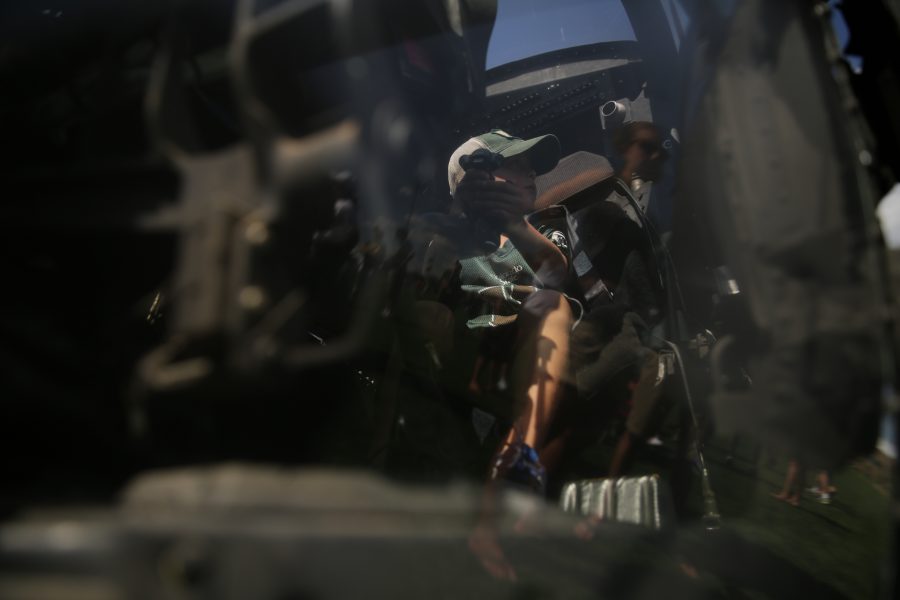 Camden McElroy checks out a UH-60 Black Hawk helicopter being displayed on the Intramural sports fields at Colorado State University before the start of the first football game of the 2017 season on Saturday, August 26th. Forrest Czarnecki | The Collegian