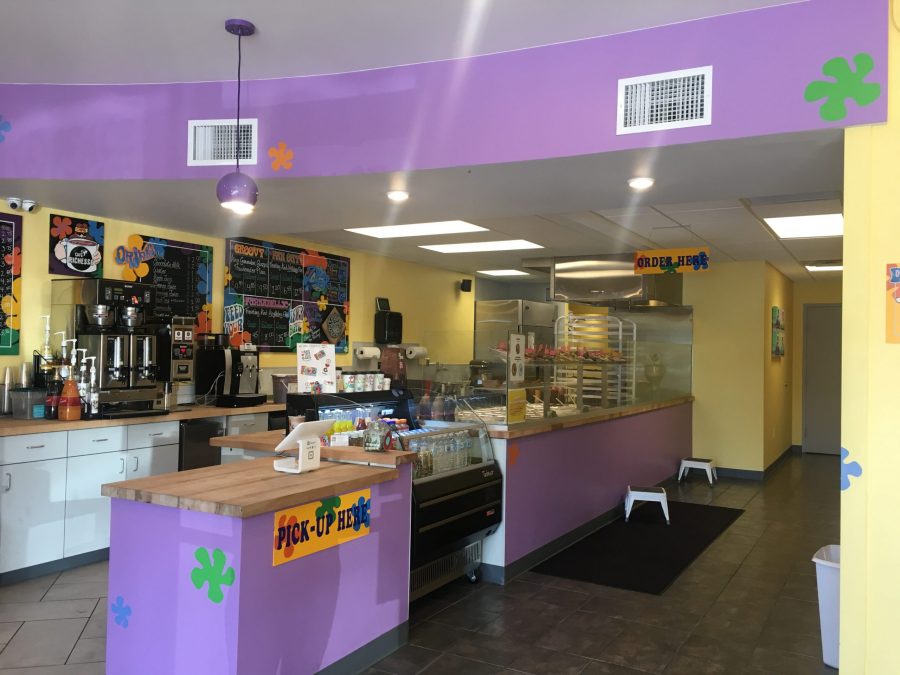 The inside of Peace, Love and Little Donuts has a 1970s aesthetic. 